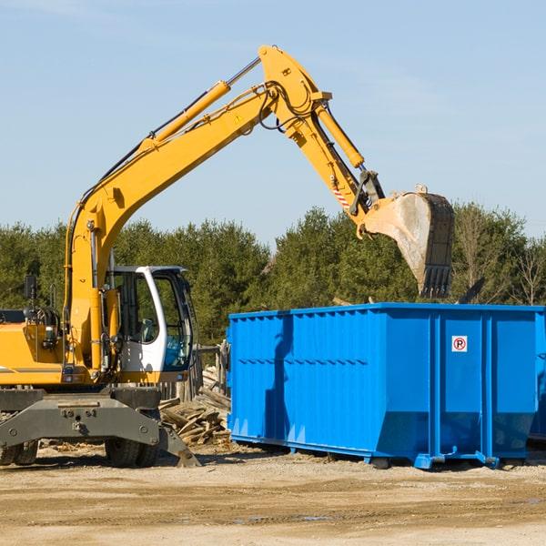 residential dumpster with a full load of debris